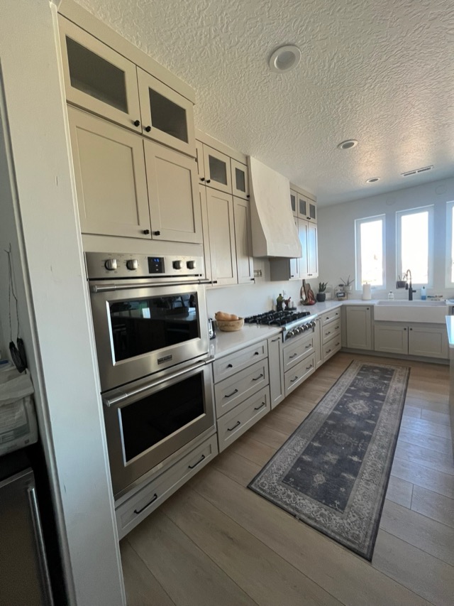 Kitchen with shaker cabinets and quartz countertop