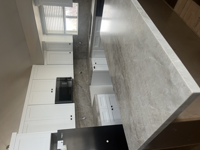 Modern kitchen remodel with new cabinets and lighting