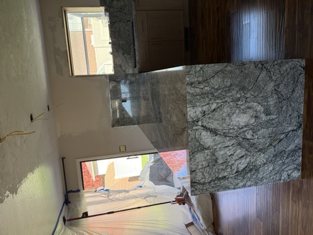 Kitchen remodel with cabinets and solid surface counters